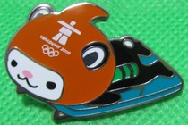 2010 Vancouver Winter Olympics badge MIGA bobsleigh mascot badge