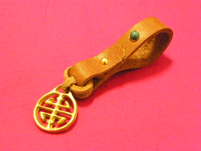 The Bundesliga copper plus a small leather strap.