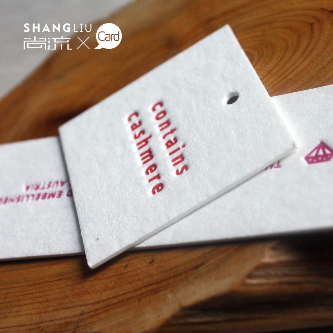 High-grade garment tag customization colored pressure concave process 450 grams thick environmental protection paper tag design printing