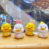 Cute creative little yellow duck shaking head electric car ornaments car carrier Net red car interior accessories office desktop decoration