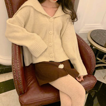 SYT legs are one meter long and eight pearl flower buttons buttocks short skirts womens autumn and winter high waist thin a-line woolen skirt