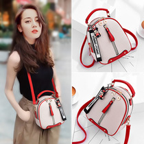 Hong Kong boomer 2021 new minimalist pop skew satchel genuine leather 100 ride fashion ins Pet Twin Shoulder Backpack Woman