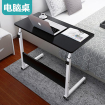 A small table on the folding bed can be a laptop desk a lazy college student a dormitory a homework desk.