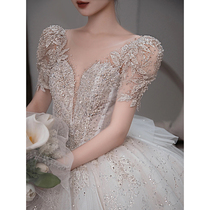 The wedding dress 2022 bride wedding main yarn heavy work luxury V-collar French drag tail senior feeling out of the yarn