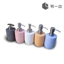 On the other side of the concrete emulsion bottle Cement high-end cosmetics dispensing bath and hand sanitizer pressing travel replacement bottle