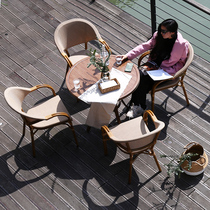 Rattan chair three-five set balcony indoor and outdoor table and chair ins simple light luxury courtyard rattan chair coffee table combination