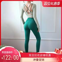 2020 autumn and winter new yoga suit suit womens back hollow yoga top high waist peach hip pants two-piece suit