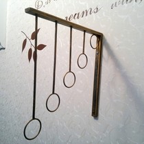 Wrought iron clothing hook Wall-mounted clothes hook Wrought iron clothing rack Clothing display rack On the wall clothes are hanging wedding dress rack