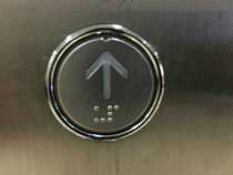 The elevator button openings 36