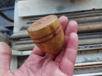 An old solid wood spinning top.