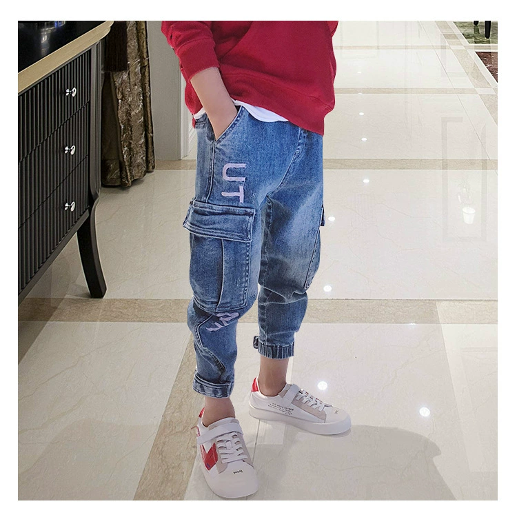 Quần jeans bé trai mùa xuân và quần áo mùa thu quần đơn Quần dài 2019 mới vừa và lớn quần harem quần trẻ em quần yếm - Quần jean