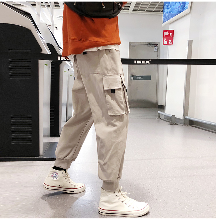 Wozi mùa thu mới màu rắn nhiều túi chùm chân overalls trẻ trung quần lỏng giản dị quần Hong Kong phong cách hoang dã quần baggy nam