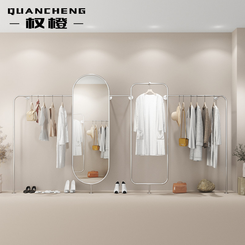 Clothing store display rack wall-mounted stainless steel titanium alloy hanging clothes rack with mirror display against the wall