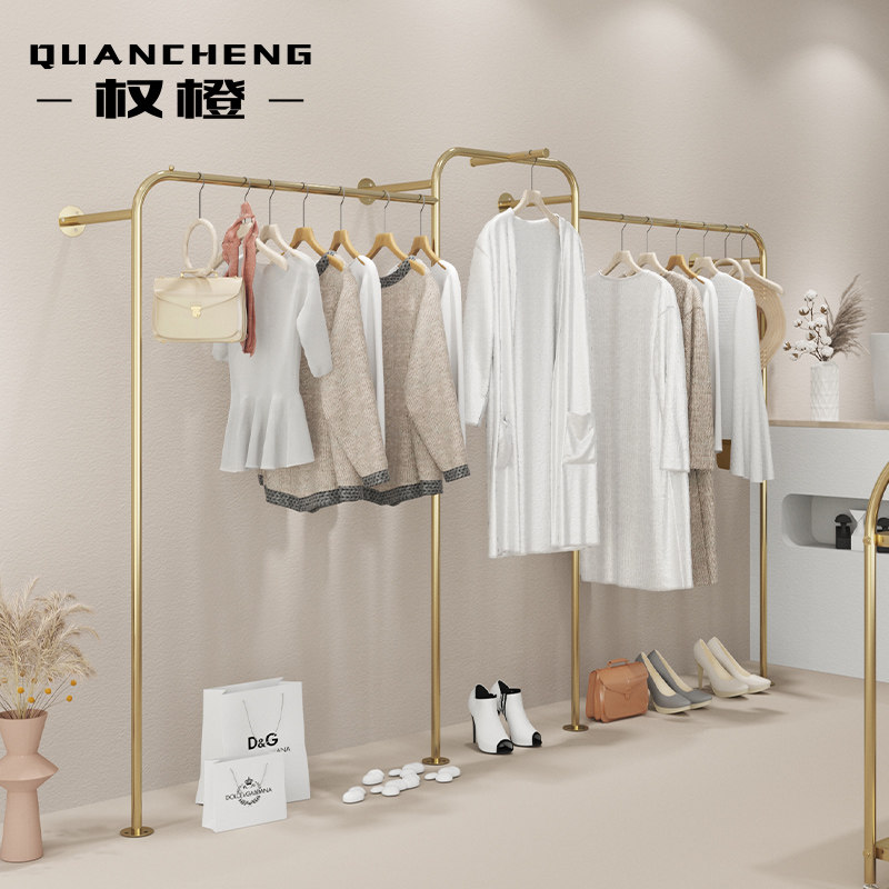 Wall-mounted stainless steel titanium alloy brushed against the wall creative clothes display rack on the net red store
