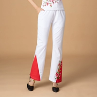 Светло -коричневые белые вышитые брюки.