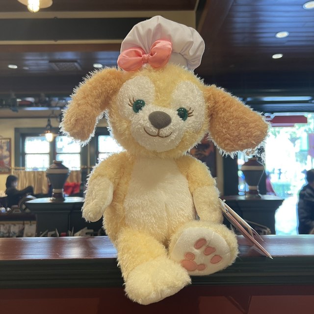 Shanghai Disneyland ຊື້ Keqian Dog Chef Biscuit Cookie Dog Plush Doll Dressing