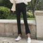 Mùa thu mới phiên bản Hàn Quốc của quần jeans đen không đều màu đen hoang dã eo cao đã mỏng chín điểm micro chuông quần nữ thủy triều quần jean lửng nữ