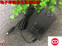 A table The ONE Light 61 Key Smart Piano Digital Electronic Keyboard Power Cord Adaptor Accessories