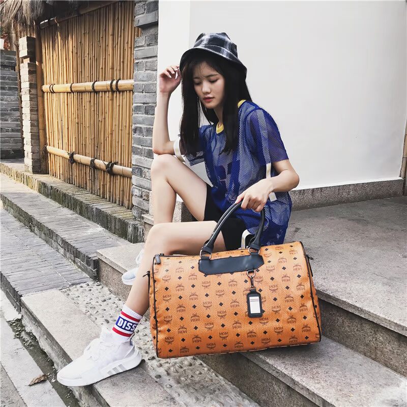 Túi thể dục nữ thủy triều dung lượng lớn nam không thấm nước túi đào tạo vai di động túi du lịch khoảng cách ngắn túi xách du lịch nữ cao cấp