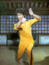 Sân khấu biểu diễn màu vàng Bruce Lee Xiêm quần áo bó sát thể thao quần áo trẻ em người lớn Kung Fu quần áo tập thể dục quần áo bé trai Áo liền quần