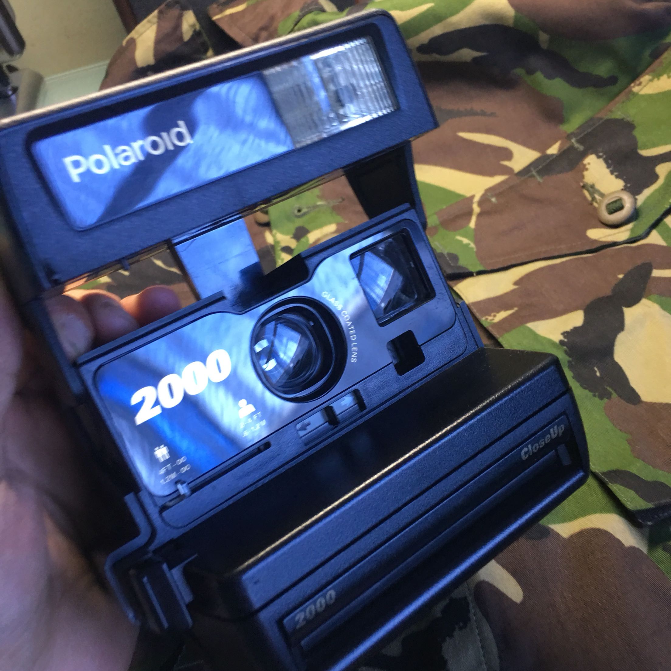 Polaroid's new 2000 Polaroid camera is in good condition and functions normally and is ready to use. Storage number 765