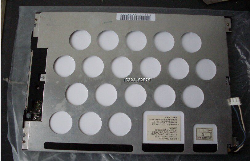 Original NL8060AC26-05 display screen in front of the box