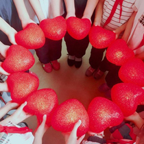 Holding glowing red love props stage chorus performance dance performance holding grateful heart red heart lamp