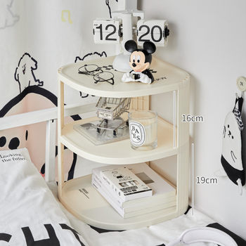 The dormitory bed rack corner bedside storage cabinet is fully included in the bed curtain storage box. the object artifact is laid on the bed