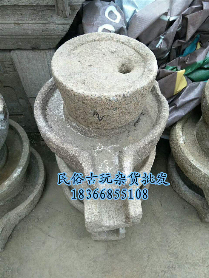 Folklore old objects nostalgic rural small stone mill handmade stone mill hand-pushed stone mill running water tea table farmhouse decoration