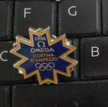 2010 Vancouver Winter Olympics badge Omega badge 1956 Italian Cortina Winter Olympics snowflake badge