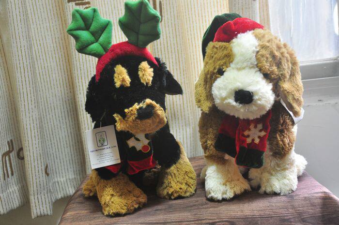 Outside single super cute puppies plush paparazzi Christmas style wearing hat and cap wearing a little deer head hoop