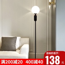 Simple modern floor lamp living room bedroom bedside lamp Net red creative black and white light luxury glass sofa vertical table lamp