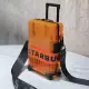 Трендовый оранжевый маленький чемодан