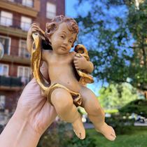 Old wood carving little angel