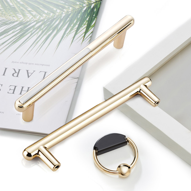 Light luxury golden cabinet door handle modern minimalist white black single-hole Nordic drawer overall cabinet wardrobe door handle