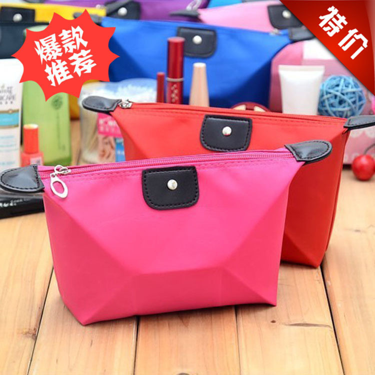 Korean version of cute dumpling cosmetic bag, candy-colored folding dumpling storage bag, ingot type waterproof toiletry bag