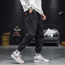 Hong Kong Tidal Wave Spring Autumn Season New Lines Splicing Casual Pants Men Small Stickers Draw Rope Tooling Bunch Foot Harun Pants