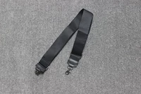 Широкий ремень из холщовой ткани черного цвета.