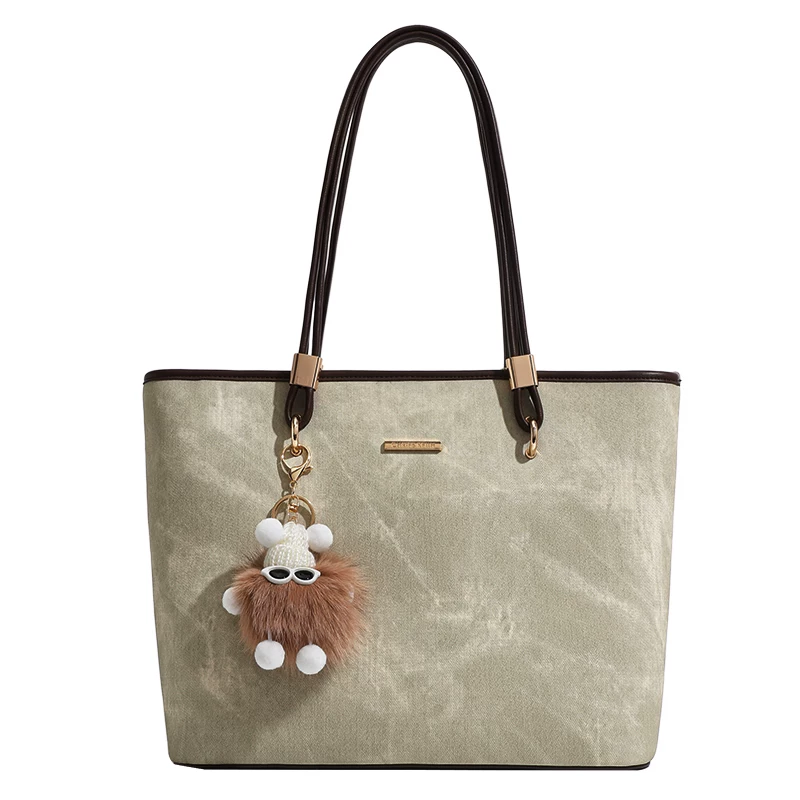 Capacious handheld one-shoulder bag