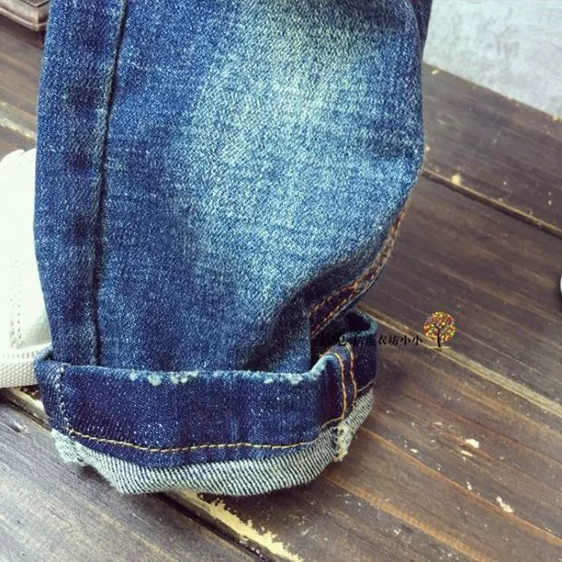 Bé trai và bé gái xuân hè quần jean trẻ em mới Hàn Quốc quần áo hoạt hình denim quần dài chân quần yếm bò bé gái đẹp