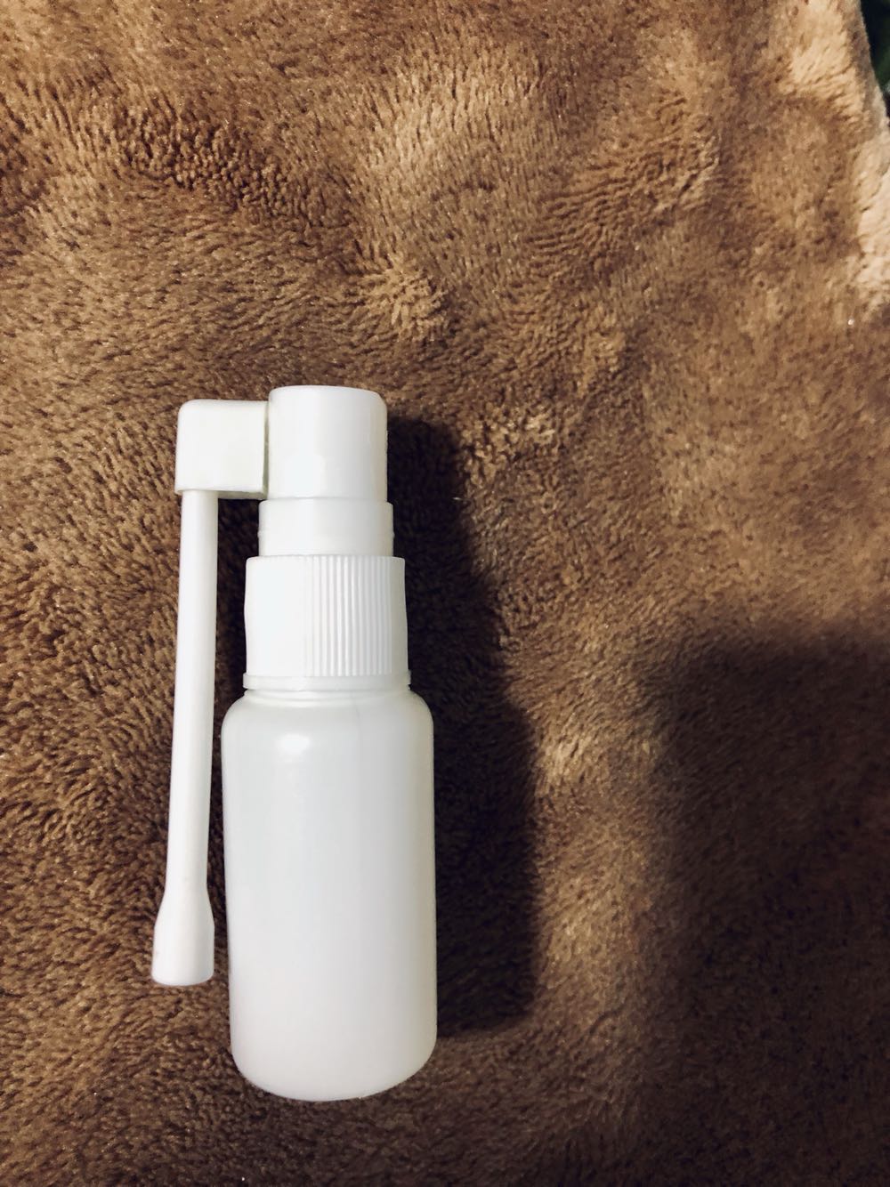 25 ml vial with a small spray bottle.