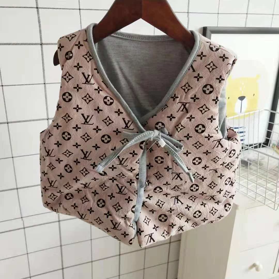 18 năm mùa thu và mùa đông quần áo trẻ em mới bé trai và bé gái áo cotton một nút áo không tay áo gile cho trẻ sơ sinh