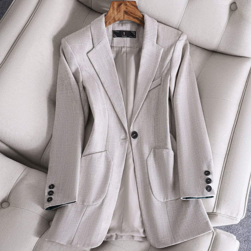The white 100 hitch a small suit jacket woman.