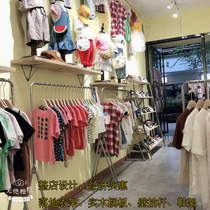 Childrens clothing store clothing display stand floor hanger wall-mounted wall solid wood shelf Childrens clothing store decoration renderings