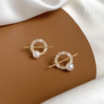 French niche unique design sense round pearl earrings female light luxury senior sense autumn and winter hollow earrings
