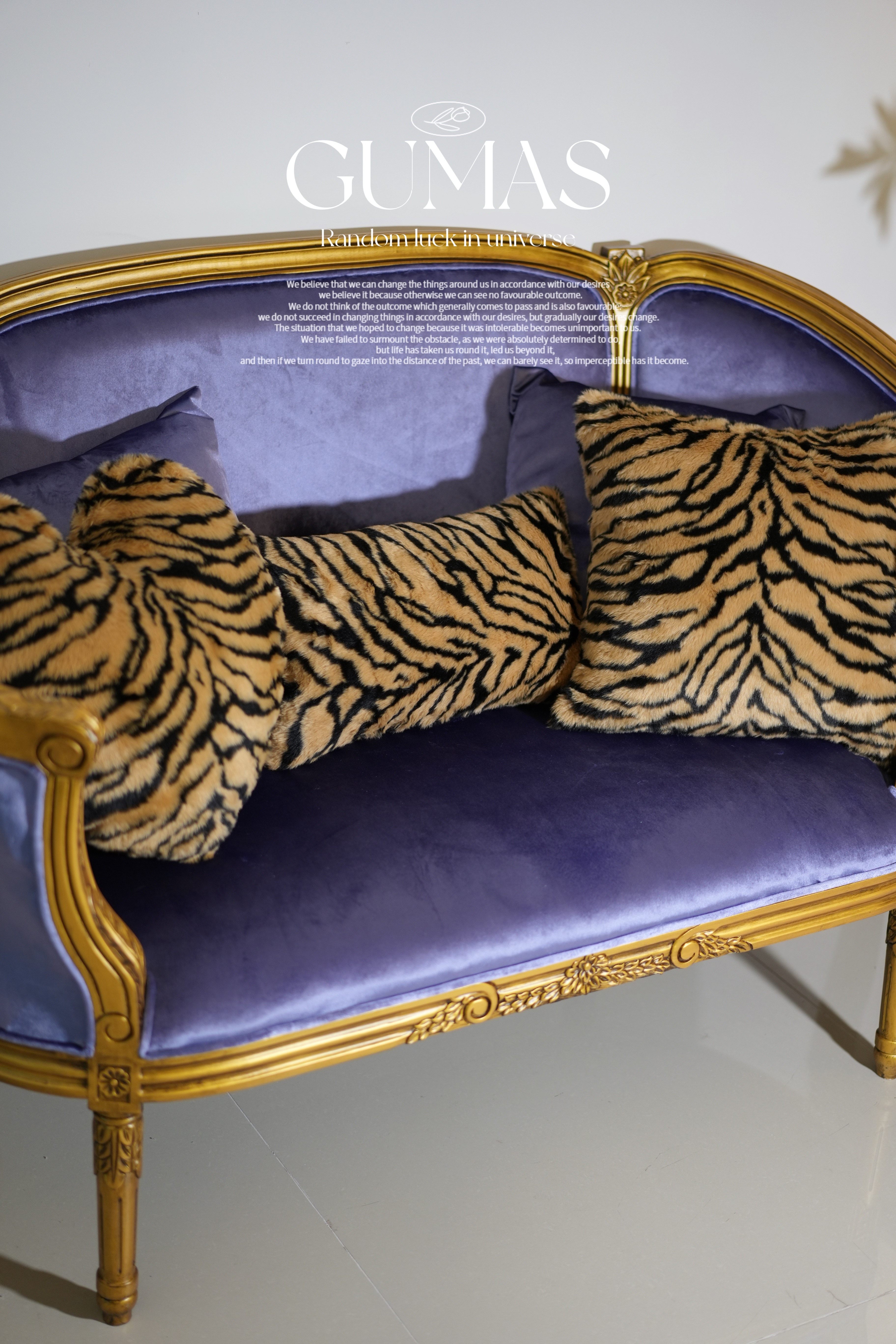 Tiger stripe plush velvet throw pillow in periwinkle blue with gold and black stripes on baroque chair