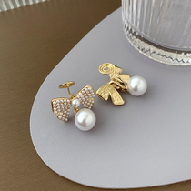 Japan-ROK sweet and beautiful pearl butterfly knot earrings female temperament net red feeling design earrings Mosquito Coil Dish without otolehole ear clip