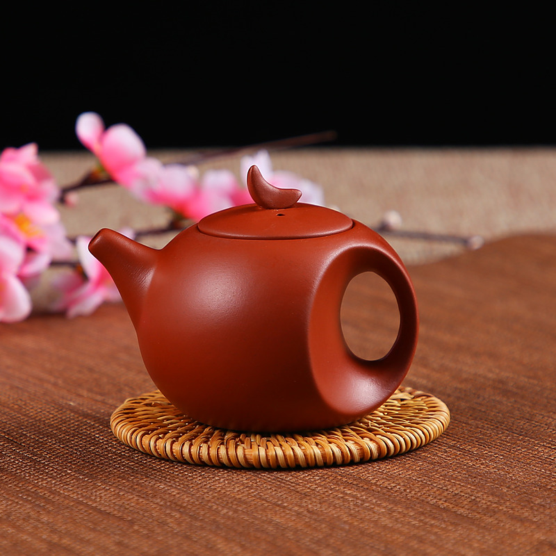 Yixing pure hand-made chocolate teapot ceramic teapot moonpot filter small bubble teapot flower teapot household