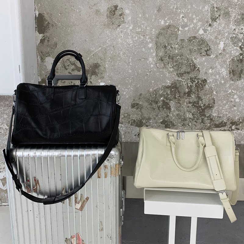 2021 new short-distance travel bag female portable leather large capacity fashion boarding business travel luggage bag male tide