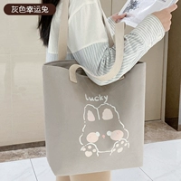 Серый счастливый кролик